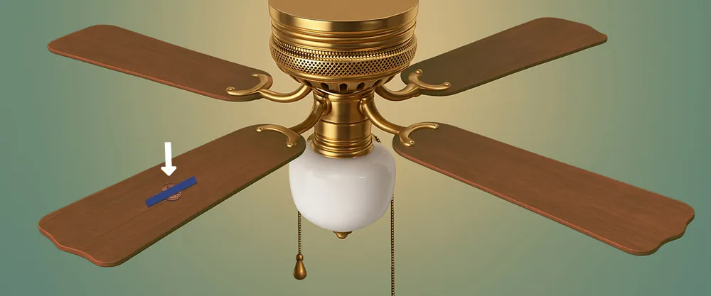 Secure a penny to the center of one of the blades with painter’s tape copia